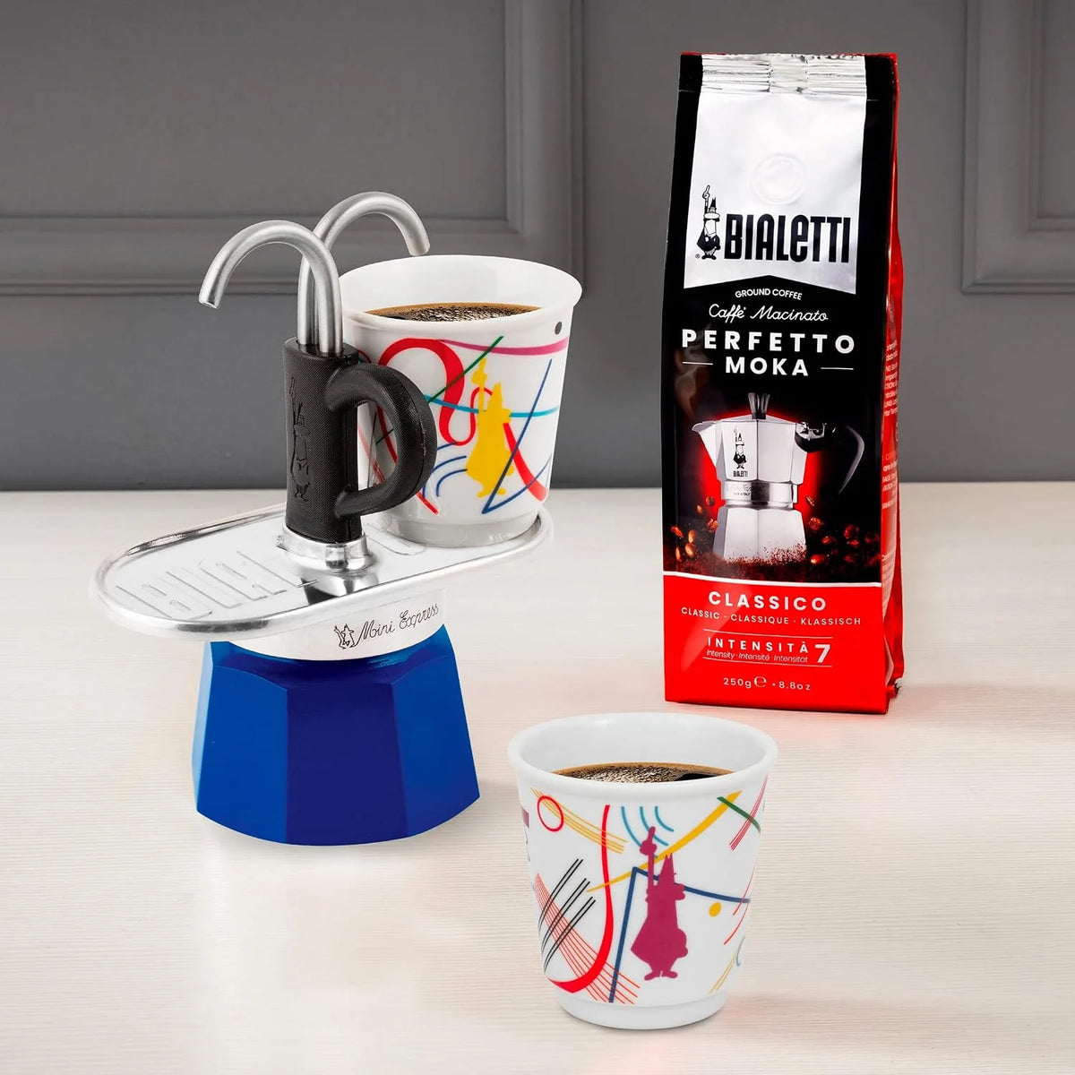 Bialetti - Mini Express Kandinsky: Moka Set includes Coffee Maker 2-Cups (2.8 Oz) + 2 shot glasses, Light Blue, Aluminum
